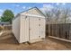 Backyard storage shed with painted wood, providing secure storage space for gardening tools and outdoor equipment at 3550 Fairfax St, Denver, CO 80207