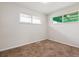 Bedroom with neutral tones, a large window, and carpeting; a blank canvas ready to be personalized at 3550 Fairfax St, Denver, CO 80207