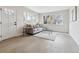 Bright living room featuring light wood floors, neutral paint, and abundant natural light at 3550 Fairfax St, Denver, CO 80207