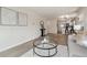 Bright living space flows into the kitchen, boasting wood floors and contemporary decor at 3550 Fairfax St, Denver, CO 80207