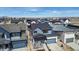 An aerial view showcasing rooftops in a neighborhood under a partly cloudy sky at 5604 Grandville Ave, Longmont, CO 80503
