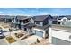An aerial view showing many rooftops in a neighborhood under a partly cloudy sky at 5604 Grandville Ave, Longmont, CO 80503