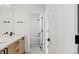 Modern bathroom with double vanity, sleek fixtures, and a combined tub and shower at 5604 Grandville Ave, Longmont, CO 80503