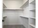 Walk-in closet featuring built-in shelving and ample storage space at 5604 Grandville Ave, Longmont, CO 80503