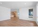 Open living space features hardwood floors, recessed lighting, and kitchen view at 5604 Grandville Ave, Longmont, CO 80503