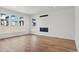 Bright living room featuring hardwood floors, contemporary fireplace, and natural light at 5604 Grandville Ave, Longmont, CO 80503