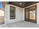 Covered patio with sliding glass door, concrete floor and a window at 5604 Grandville Ave, Longmont, CO 80503