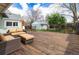 Spacious back deck with ample seating and view of fenced-in backyard at 2074 S Emerson St, Denver, CO 80210