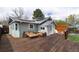 Inviting back deck with stylish outdoor seating, perfect for relaxing and entertaining at 2074 S Emerson St, Denver, CO 80210