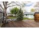 Back yard with mature trees and wooden deck at 2074 S Emerson St, Denver, CO 80210