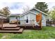 Back yard features a multi-tiered deck, offering plenty of outdoor living space at 2074 S Emerson St, Denver, CO 80210