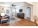 Spacious living room with hardwood floors and a connecting dining area at 2074 S Emerson St, Denver, CO 80210