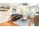 Comfortable living room with hardwood floors, a ceiling fan, and stylish furnishings at 2074 S Emerson St, Denver, CO 80210