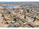 An aerial view showcases a quiet neighborhood with single-Gathering homes and a nearby lake at 3175 W Stanford Ave, Englewood, CO 80110