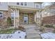 Inviting front entrance with stone detailing and a covered porch at 1188 S Pitkin Way, Aurora, CO 80017