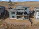 Aerial view of home showcasing backyard and hillside location at 9524 Fork Bluff Pt, Lone Tree, CO 80124