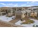 Modern home with a three-car garage and views of the surrounding landscape at 9524 Fork Bluff Pt, Lone Tree, CO 80124