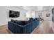 Spacious basement with sectional sofa and wood floors at 9524 Fork Bluff Pt, Lone Tree, CO 80124