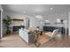 Relaxing basement lounge with comfortable seating and a wet bar at 9524 Fork Bluff Pt, Lone Tree, CO 80124