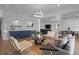 Spacious basement recreation area with seating and wet bar at 9524 Fork Bluff Pt, Lone Tree, CO 80124
