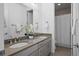 Bathroom boasts double vanity and shower at 9524 Fork Bluff Pt, Lone Tree, CO 80124