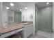 Modern bathroom with a walk-in shower and double vanity at 9524 Fork Bluff Pt, Lone Tree, CO 80124