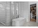 Modern bathroom with a large soaking tub and walk-in shower at 9524 Fork Bluff Pt, Lone Tree, CO 80124