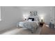 Comfortable bedroom with a metal-framed bed and neutral decor at 9524 Fork Bluff Pt, Lone Tree, CO 80124