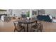 Open dining area with modern table and chairs, adjacent to living space at 9524 Fork Bluff Pt, Lone Tree, CO 80124