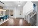 Bright and spacious entryway with hardwood floors and a staircase at 9524 Fork Bluff Pt, Lone Tree, CO 80124
