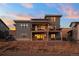 Modern home exterior; two-story, gray siding at 9524 Fork Bluff Pt, Lone Tree, CO 80124