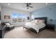 Spacious main bedroom with mountain views and a large window at 9524 Fork Bluff Pt, Lone Tree, CO 80124