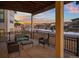 Covered patio with seating area, overlooking neighborhood at 9524 Fork Bluff Pt, Lone Tree, CO 80124