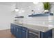 Basement wet bar with sleek cabinetry and a wine cooler at 9524 Fork Bluff Pt, Lone Tree, CO 80124