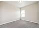 Cozy bedroom with soft carpet, natural light from the window, and neutral wall colors at 21295 E 61St Dr, Aurora, CO 80019