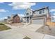 Charming two-story home with a two car garage and well-maintained lawn at 21295 E 61St Dr, Aurora, CO 80019