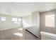 Bright hallway with natural light featuring plush carpeting and neutral paint, great for decor at 21295 E 61St Dr, Aurora, CO 80019