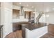 Modern kitchen with stainless steel appliances, center island and hard wood floors at 21295 E 61St Dr, Aurora, CO 80019