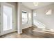 Living room with natural light, wood floors, and access to the outdoors at 21295 E 61St Dr, Aurora, CO 80019