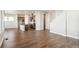 Open-concept space featuring wood floors, recessed lighting, and an island with modern kitchen at 21295 E 61St Dr, Aurora, CO 80019