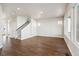 Bright and airy room with wood floors and staircase at 21295 E 61St Dr, Aurora, CO 80019