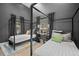 Modern bedroom featuring two beds with black frames, gray walls, and decoratively colored pillows at 379 Rainbow Rd, Idaho Springs, CO 80452
