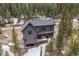 Mountain home exterior with gray siding, deck, and forest views at 379 Rainbow Rd, Idaho Springs, CO 80452