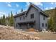 Modern home exterior featuring sleek design, wood accents, and well-maintained landscaping at 379 Rainbow Rd, Idaho Springs, CO 80452