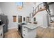 Modern kitchen with island cooktop, stainless steel appliances, and hardwood floors at 379 Rainbow Rd, Idaho Springs, CO 80452
