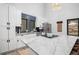 Bright, modern kitchen with a marble island, white cabinets, and stainless steel appliances at 379 Rainbow Rd, Idaho Springs, CO 80452