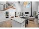 Spacious kitchen with marble island, sleek appliances, and access to the living area at 379 Rainbow Rd, Idaho Springs, CO 80452