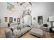Living space showcasing the staircase and open floor plan to the kitchen with vaulted ceilings at 379 Rainbow Rd, Idaho Springs, CO 80452