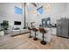 Open living room and kitchen with modern appliances and vaulted ceilings and pendant lights at 379 Rainbow Rd, Idaho Springs, CO 80452