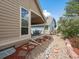 Cozy covered patio and landscaped backyard offers an inviting outdoor space for relaxation and entertainment at 7158 W Belmont Dr, Littleton, CO 80123